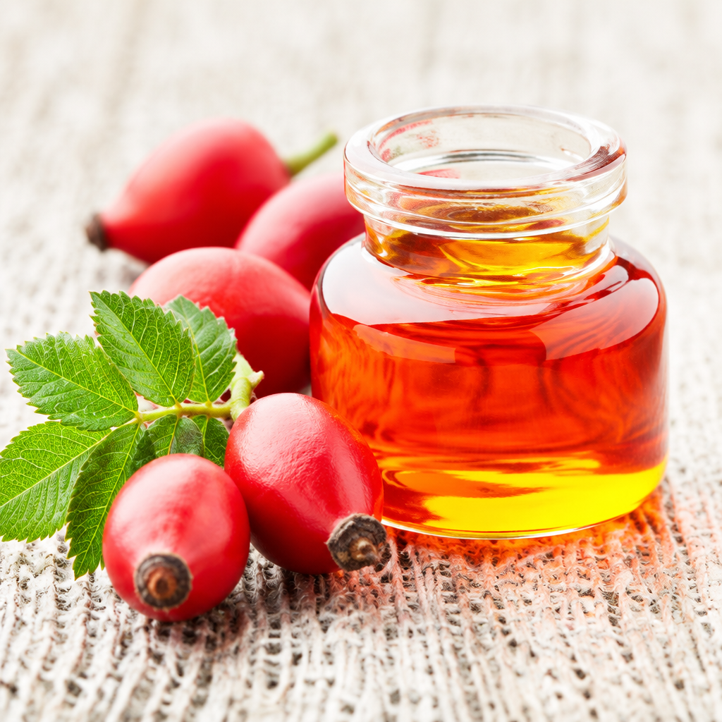 Rosehip oil and rosehips on a neutral background